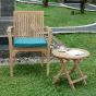 Table basse ronde en teck massif de qualité Ecograde© Kuta en compagnie du fauteuil empilable Lombok